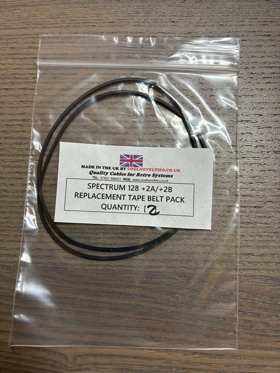 A small plastic bag with two black rubber replacement belts, labelled as a Spectrum tape belt pack.
