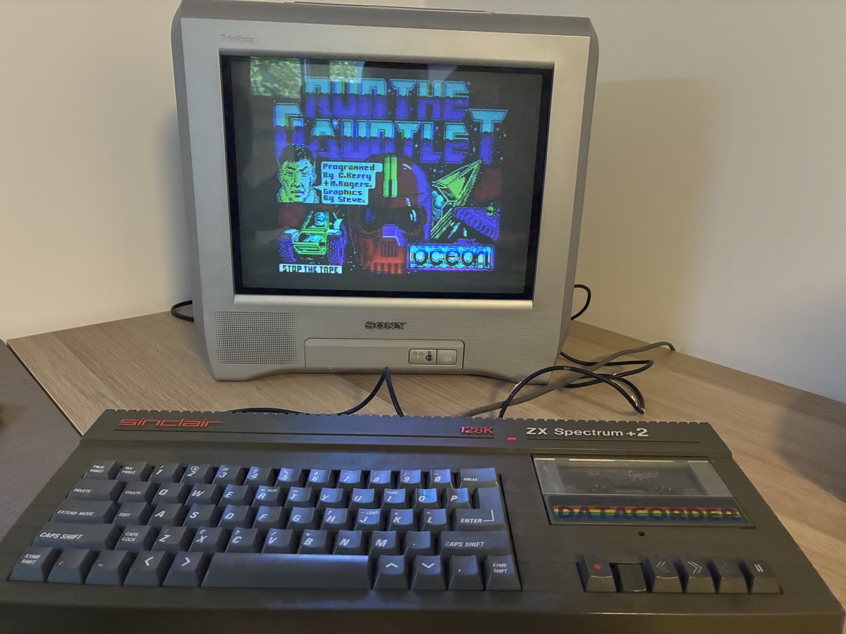 The Sony CRT showing the Run the Gauntlet loading screen by Ocean, with the +2 in front of it.
